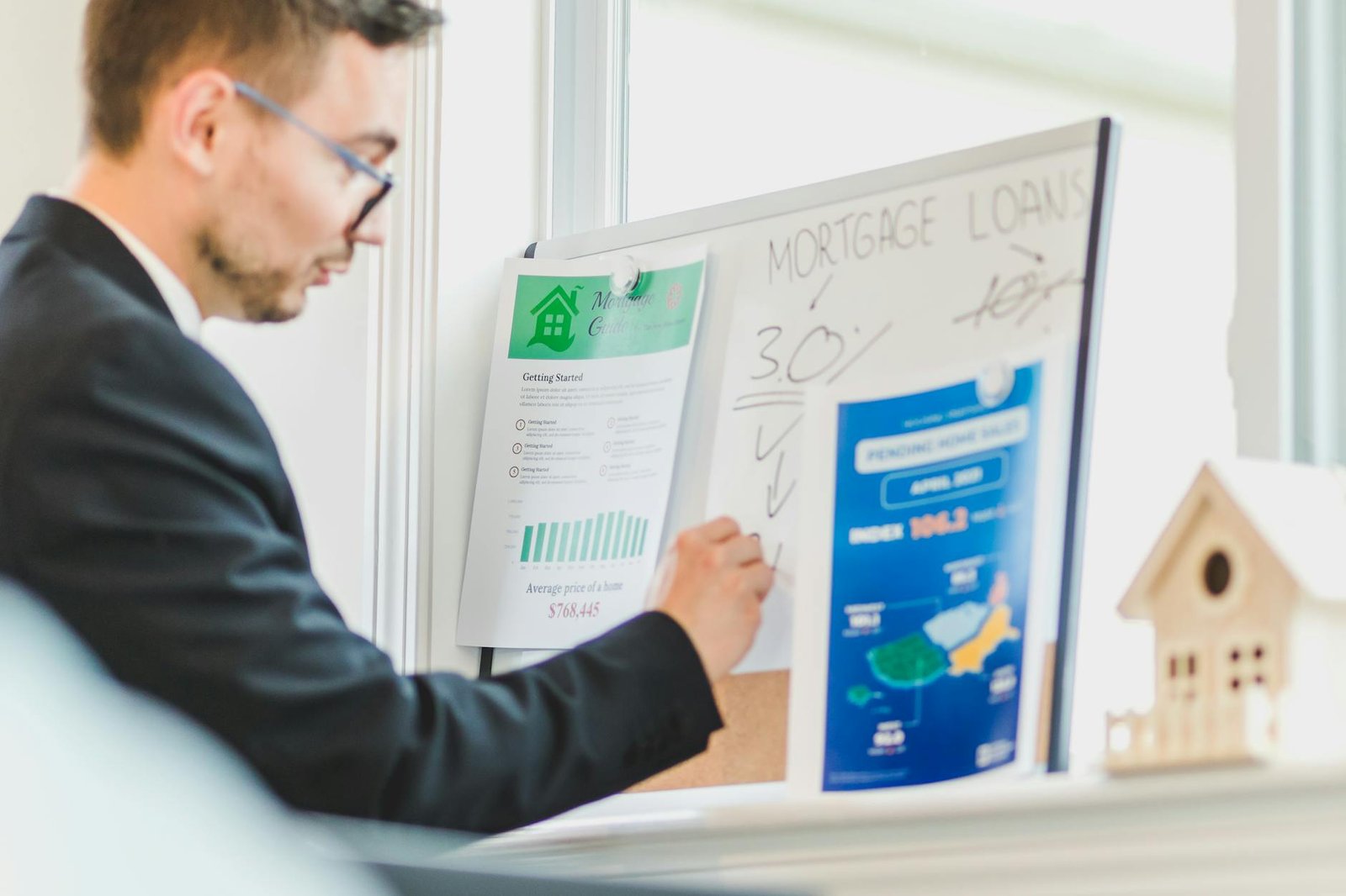 a man writing on white board