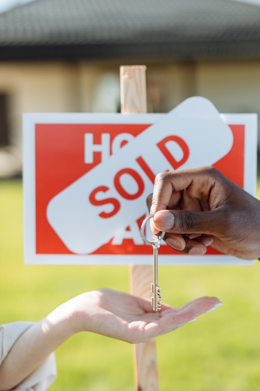 close up photo of a hands and a key